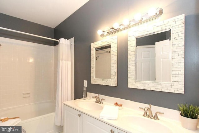 bathroom featuring shower / bathtub combination with curtain and vanity