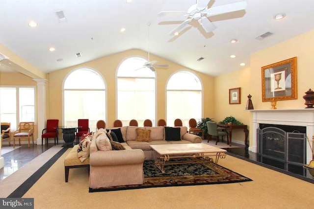 living room with ornate columns, lofted ceiling, and ceiling fan