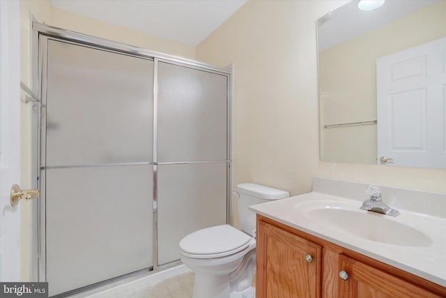 bathroom with vanity, toilet, and walk in shower