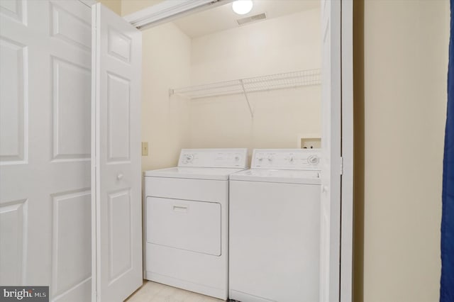 laundry area with separate washer and dryer