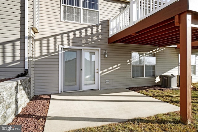 property entrance with a patio and central AC