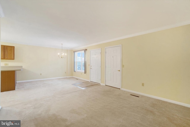 interior space featuring ornamental molding, light colored carpet, and an inviting chandelier