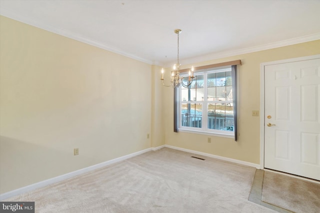 unfurnished dining area with crown molding, carpet, and an inviting chandelier