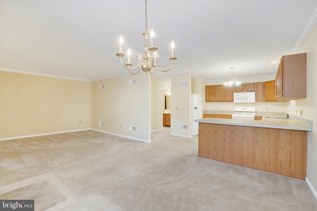 kitchen featuring sink, crown molding, range, a chandelier, and light carpet