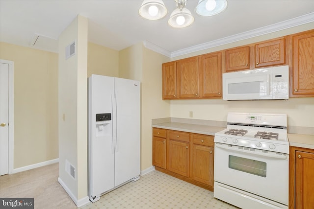 kitchen with crown molding and white appliances