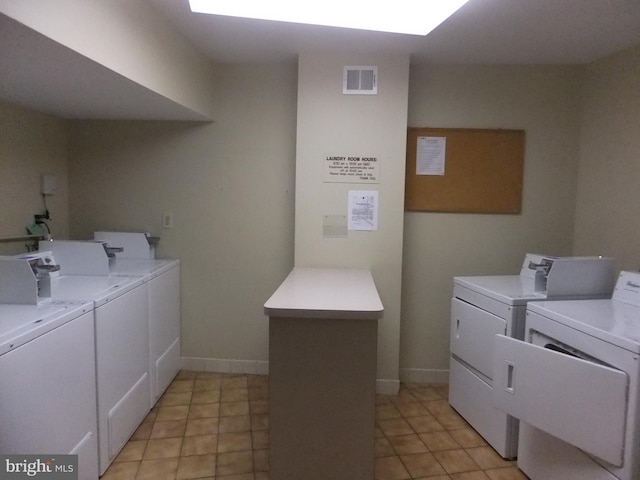 laundry room with independent washer and dryer