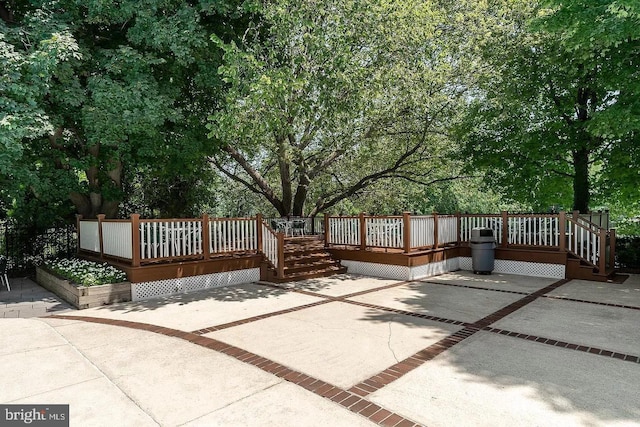 wooden terrace with a patio