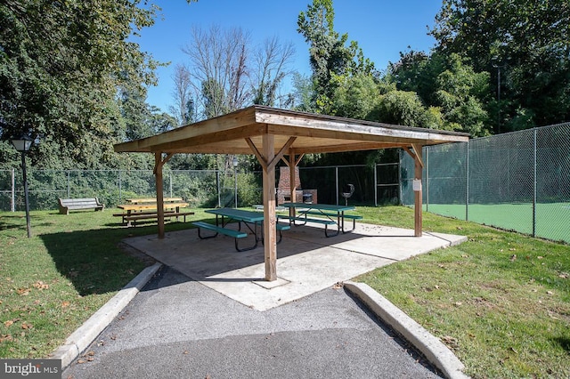 view of home's community with a yard and a patio