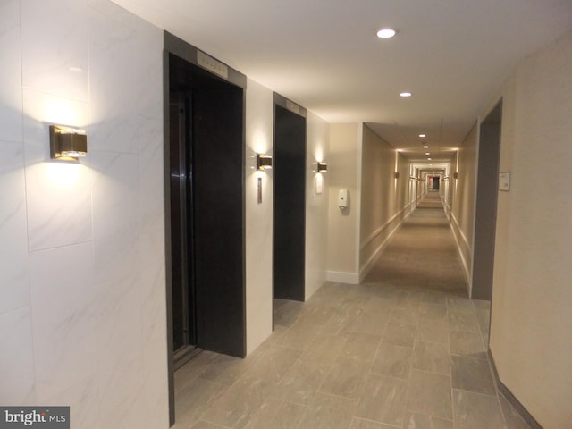 corridor featuring elevator