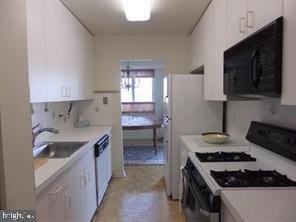 kitchen with white cabinetry, sink, range with gas stovetop, and dishwasher