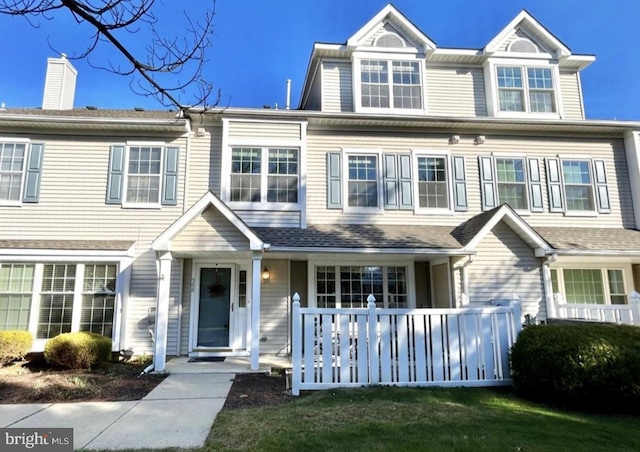 view of property with a front lawn