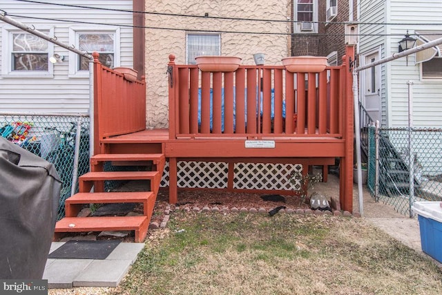 wooden terrace featuring grilling area