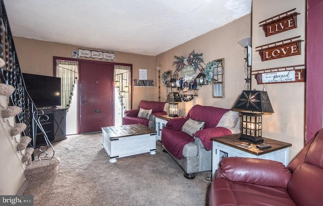 carpeted living room with a textured ceiling