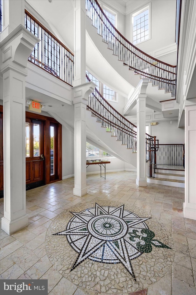 entrance foyer with plenty of natural light and ornate columns