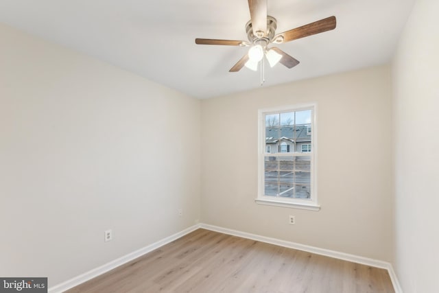 unfurnished room with a ceiling fan, light wood-style flooring, and baseboards