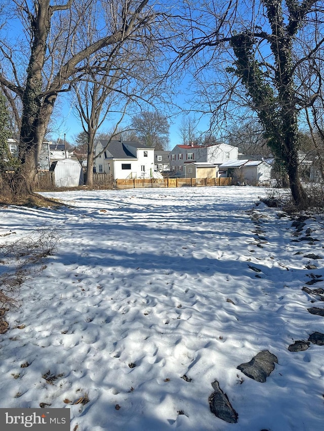 view of yard layered in snow