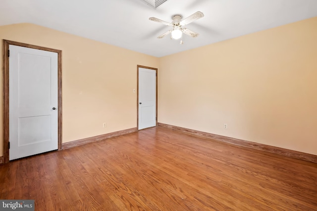 spare room with hardwood / wood-style flooring and ceiling fan