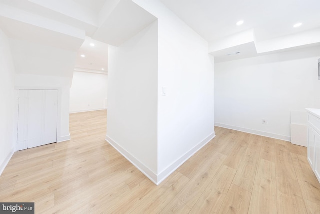 interior space with light wood-type flooring, baseboards, and recessed lighting