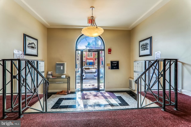 entryway featuring carpet flooring