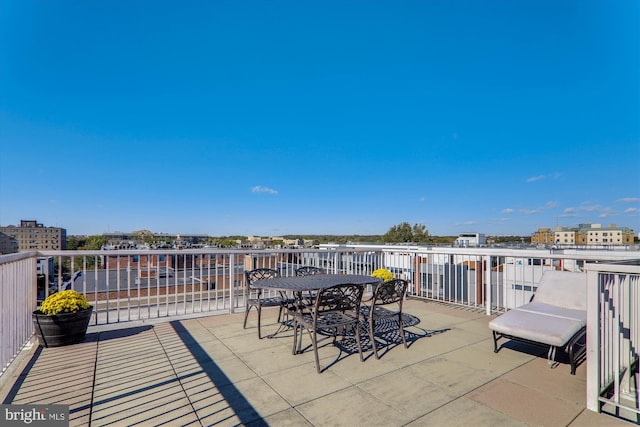 view of patio featuring a balcony