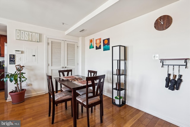 dining space featuring hardwood / wood-style flooring