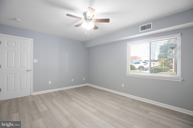 unfurnished room featuring light hardwood / wood-style flooring and ceiling fan