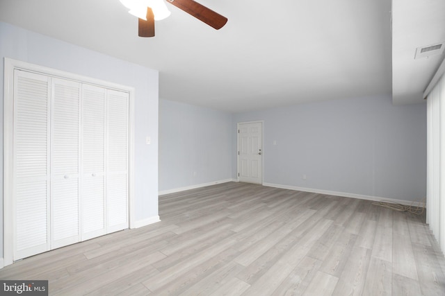 unfurnished bedroom featuring a closet, ceiling fan, and light wood-type flooring