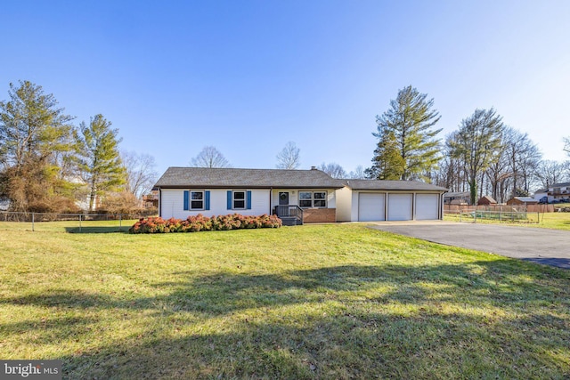 view of front facade featuring a garage and a front lawn