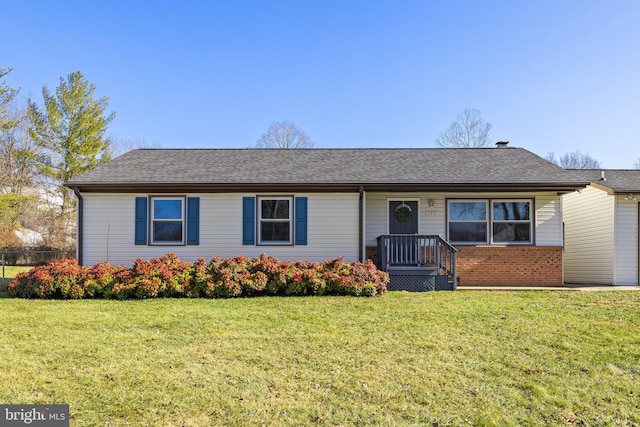 ranch-style home with a front lawn