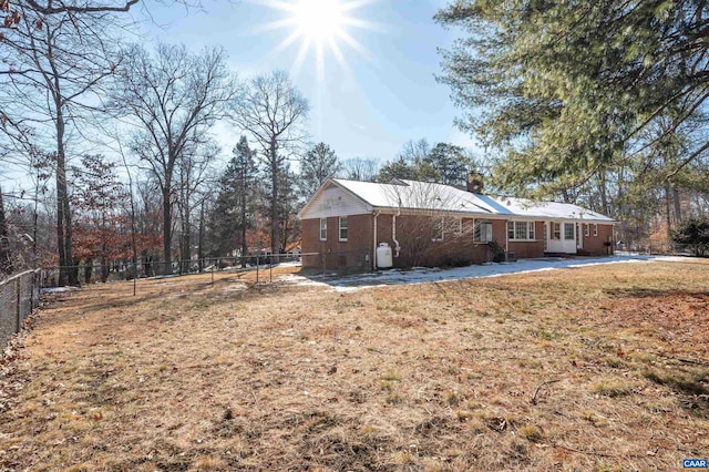 view of home's exterior with a yard