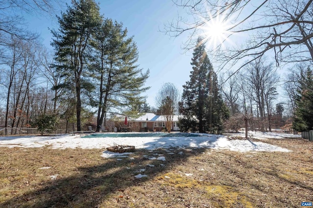 view of yard featuring a covered pool