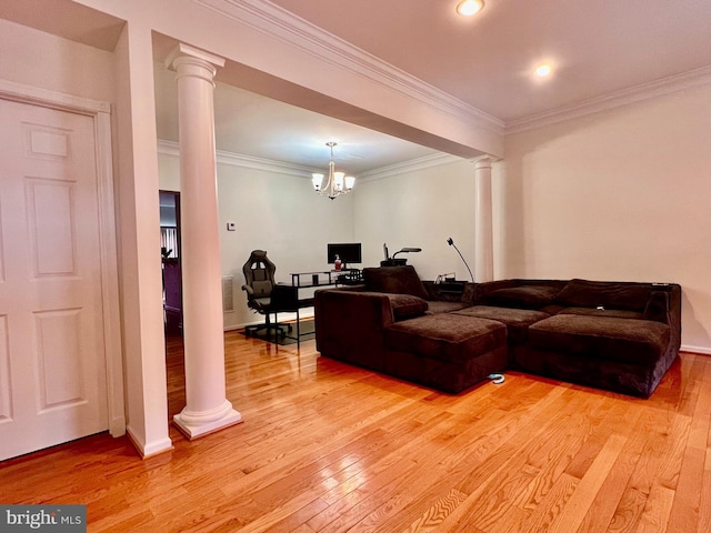 living room with crown molding, light hardwood / wood-style floors, and ornate columns