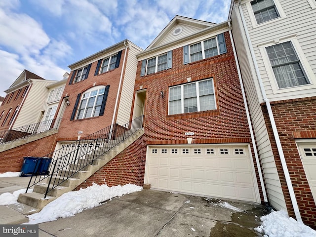 townhome / multi-family property featuring a garage