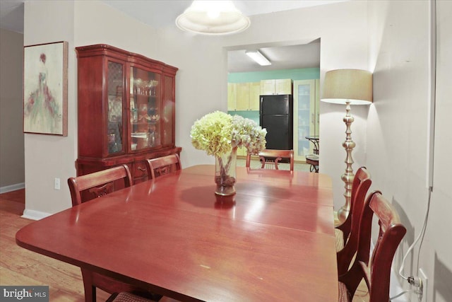 dining space featuring light hardwood / wood-style flooring