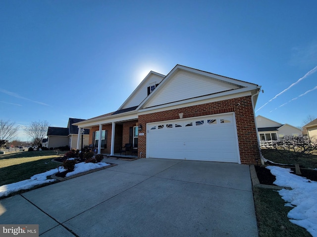 view of front of house featuring a garage and a porch