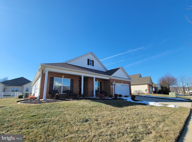 view of front of house featuring a garage and a front yard