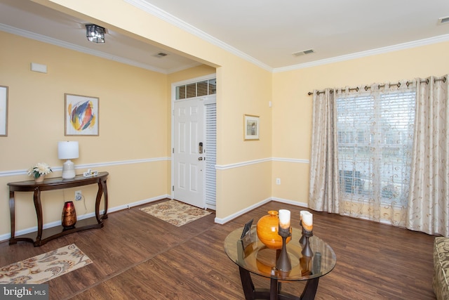 foyer with crown molding and dark hardwood / wood-style floors