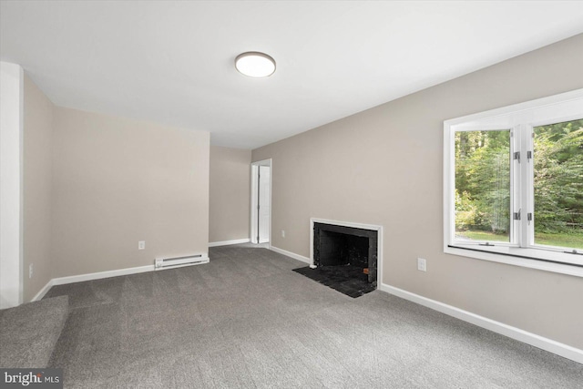 unfurnished living room with dark colored carpet and baseboard heating