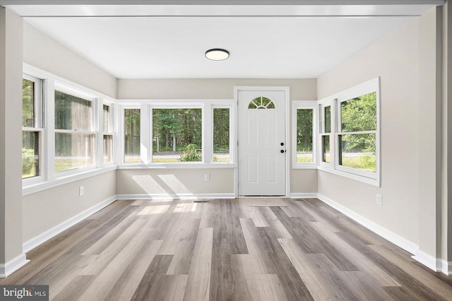 foyer entrance with light hardwood / wood-style flooring