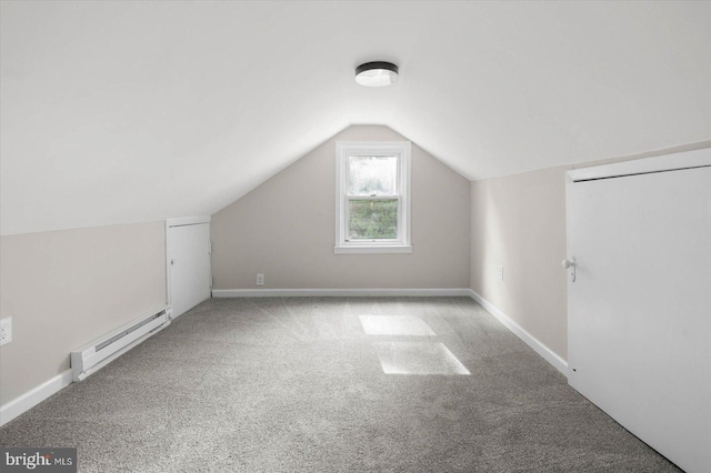 bonus room with a baseboard radiator, lofted ceiling, and light colored carpet