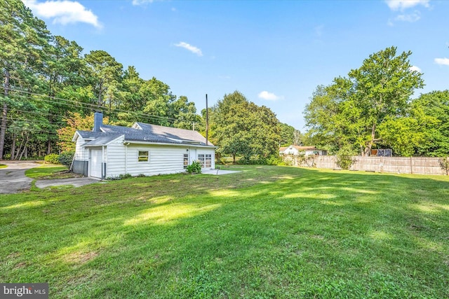 view of yard featuring a garage