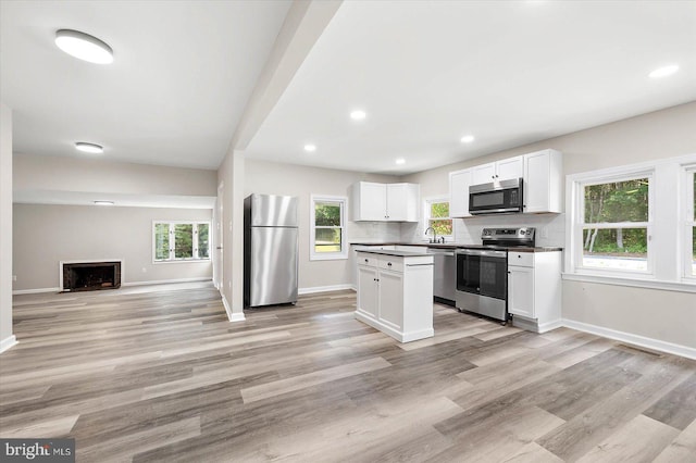 kitchen featuring white cabinetry, sink, tasteful backsplash, and appliances with stainless steel finishes