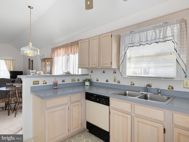 kitchen featuring sink, dishwasher, decorative light fixtures, vaulted ceiling, and kitchen peninsula