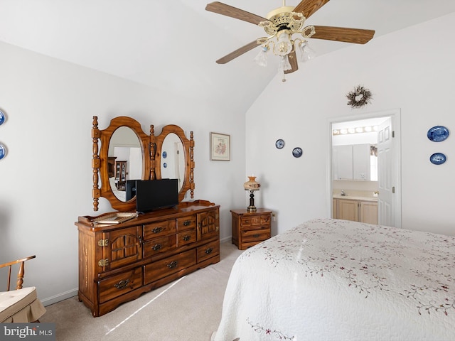 bedroom with ceiling fan, ensuite bath, lofted ceiling, and light carpet