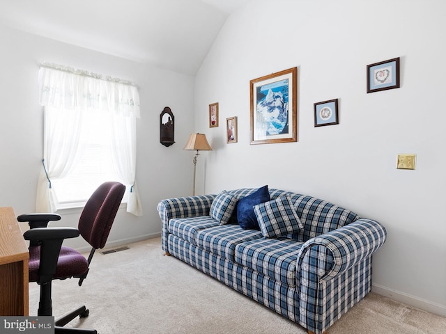 home office featuring vaulted ceiling and carpet