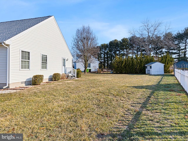 view of yard with a storage shed