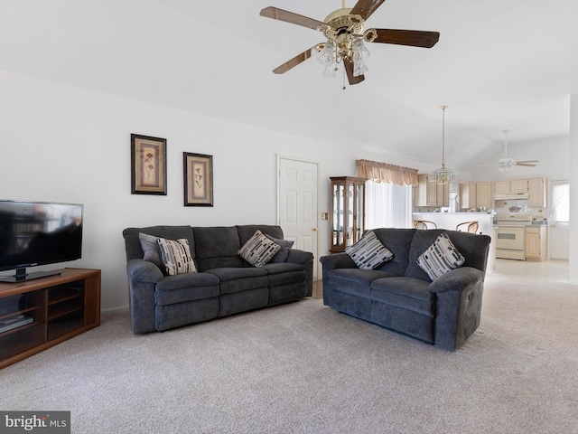 carpeted living room featuring vaulted ceiling and ceiling fan