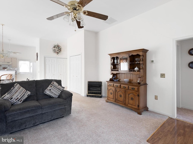 living room with light colored carpet and ceiling fan