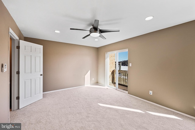 carpeted empty room with ceiling fan