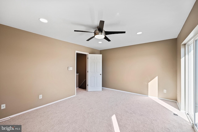 unfurnished bedroom featuring ceiling fan and light carpet